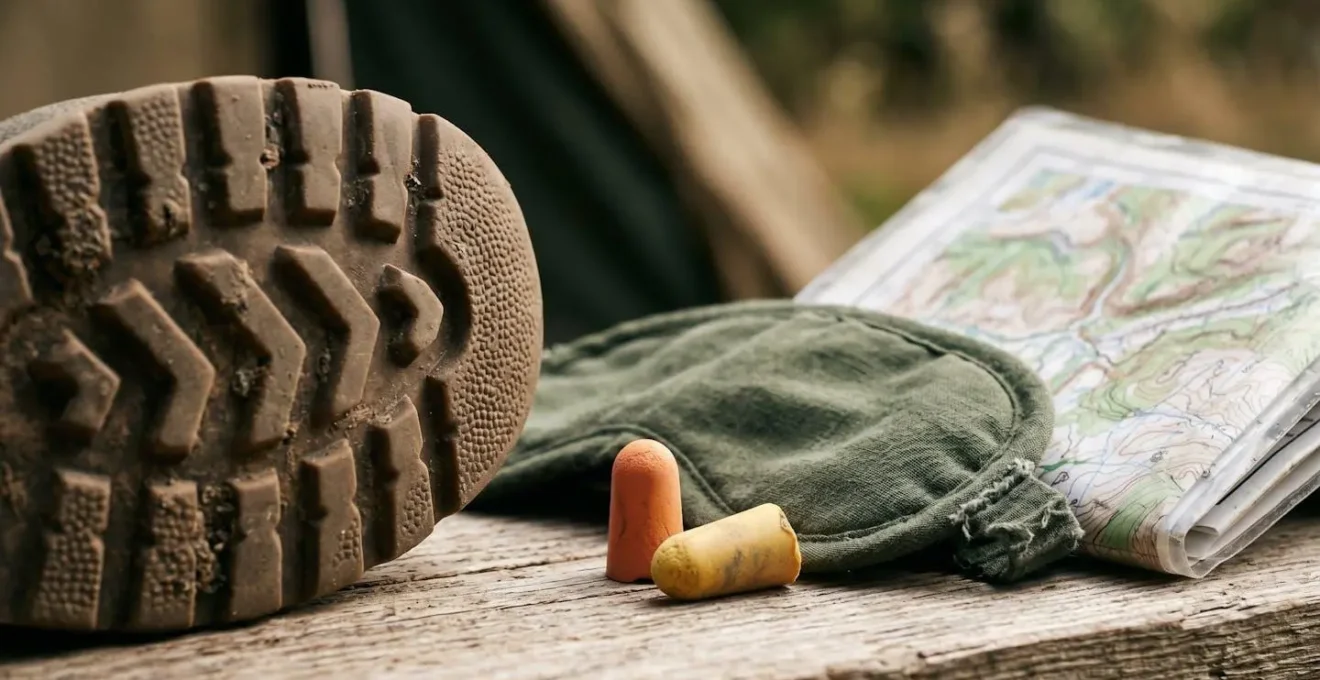 Macro close-up of essential festival survival items showing textures and materials for multi-day camping endurance