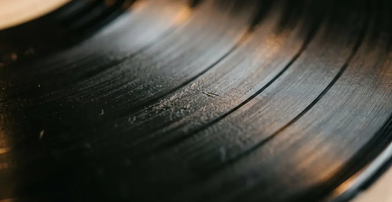 Macro photograph capturing the concept of repetition fatigue and context collapse in viral music